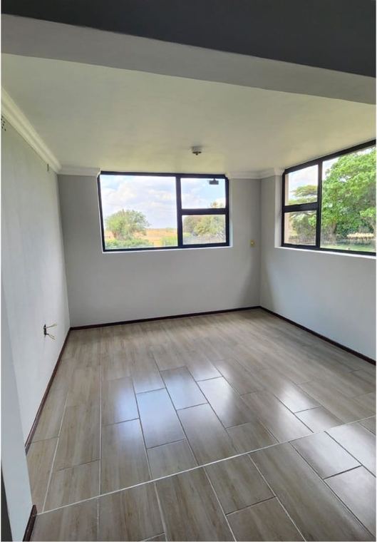 The same room after the renovation, plastered, painted and tiled