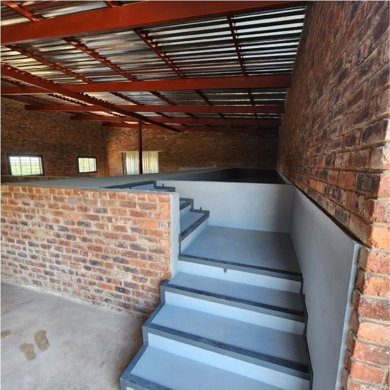 Cast concrete stairs between face brick walls